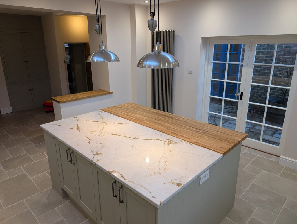 Deerwood Construction kitchen island and lighting detail from whole-house refurbishment in Crowborough East Sussex.