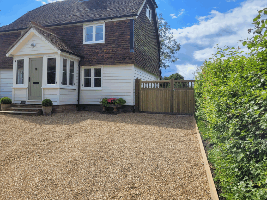 Home refurbishment by Deerwood Construction in Crowborough East Sussex featuring new porch, cladding, and driveway.